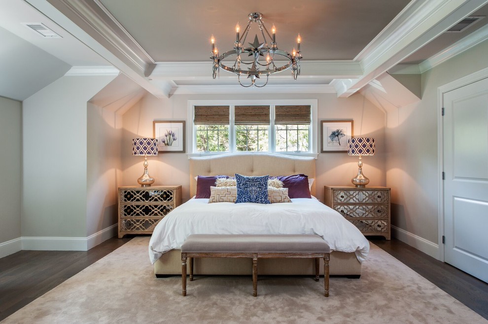 Large traditional master bedroom in Boston with beige walls and dark hardwood flooring.