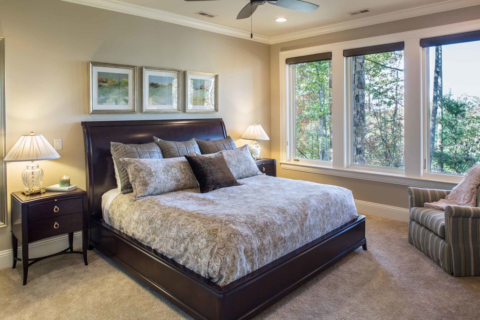 Design ideas for a large traditional bedroom with beige walls, carpet and beige floors.