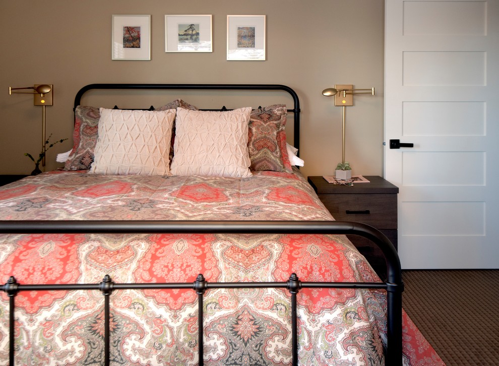 This is an example of a medium sized traditional guest bedroom in Calgary with beige walls and carpet.