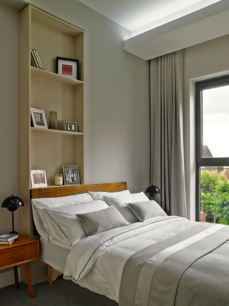 Idéer för funkis sovrum, med grå väggar och heltäckningsmatta