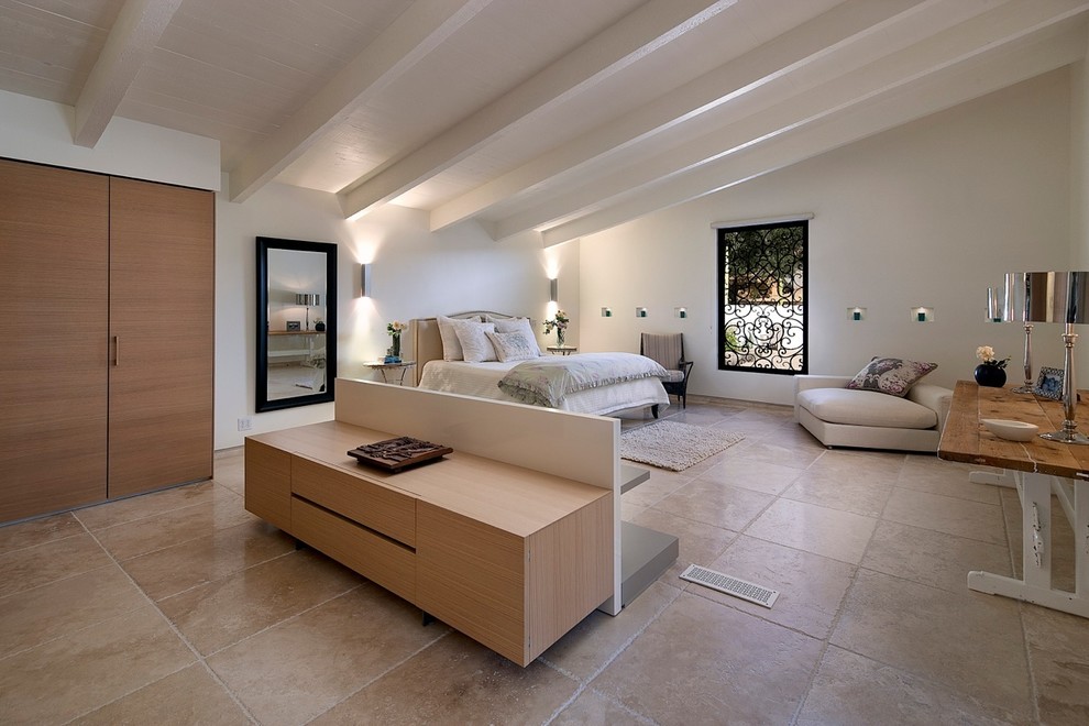 Inspiration for a large contemporary master bedroom in San Luis Obispo with white walls, limestone flooring and beige floors.