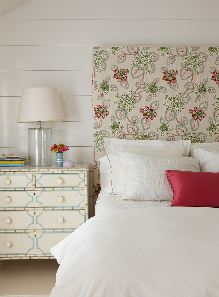 Example of a mid-sized beach style guest porcelain tile and beige floor bedroom design in Boston with white walls and no fireplace
