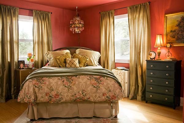 Medium sized traditional master bedroom in Other with red walls and bamboo flooring.