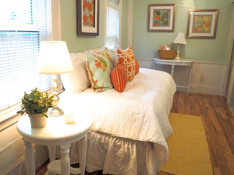 Design ideas for a medium sized classic guest bedroom in Boston with blue walls and medium hardwood flooring.