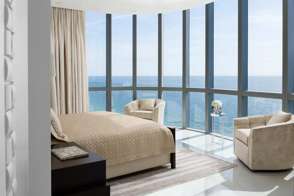 Example of a mid-sized trendy master beige floor bedroom design in Miami with no fireplace