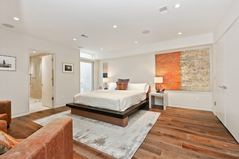 Inspiration for a mid-sized contemporary master porcelain tile and brown floor bedroom remodel in San Francisco with white walls and no fireplace
