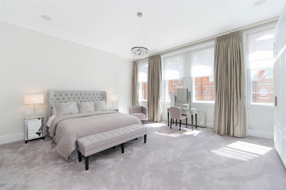 This is an example of a classic bedroom in London with grey walls, carpet and grey floors.