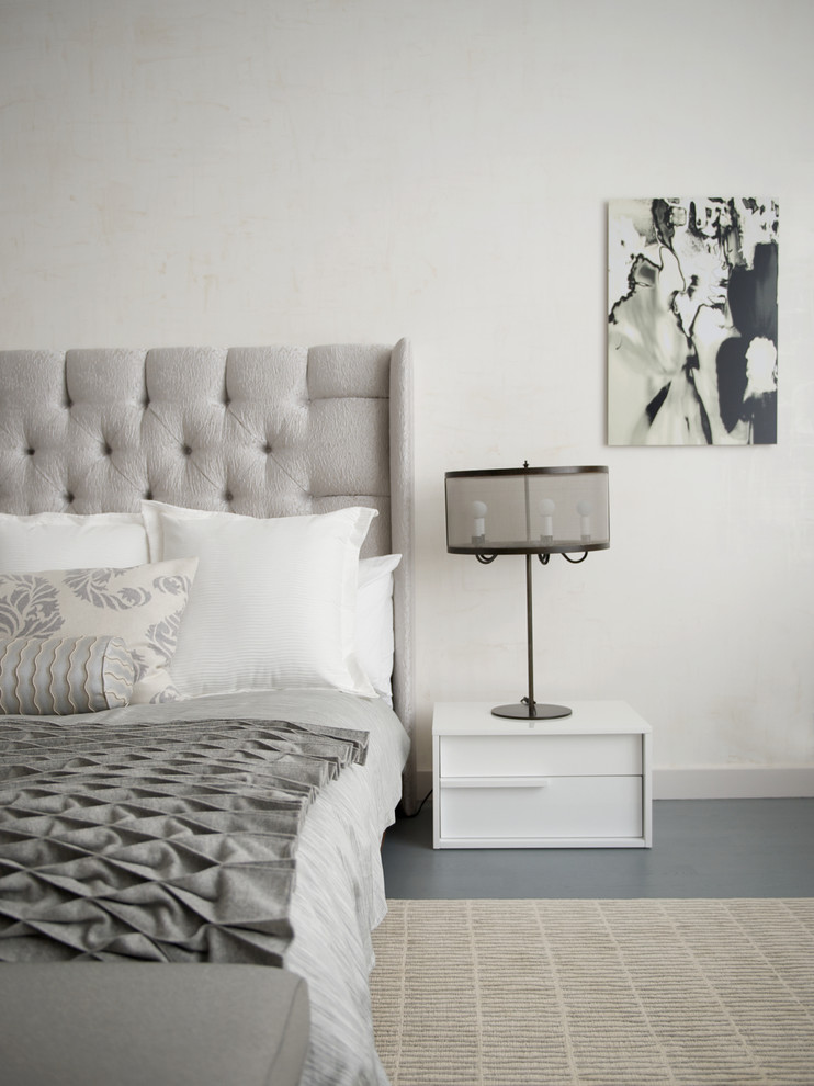Photo of a medium sized contemporary master, grey and white and grey and silver bedroom in New York with white walls and marble flooring.