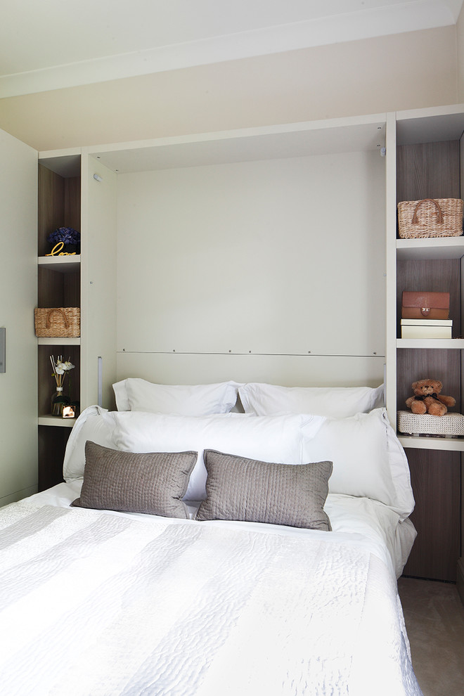 Photo of a contemporary grey and silver bedroom in Other with beige walls.