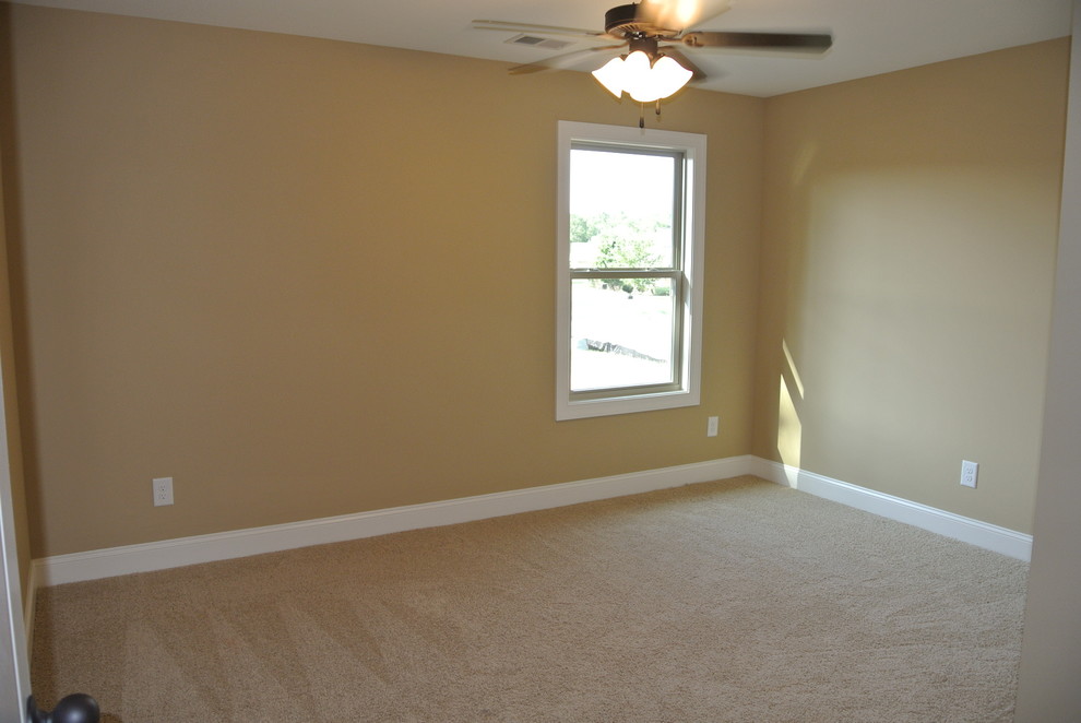 Medium sized classic master bedroom in Atlanta with beige walls and carpet.
