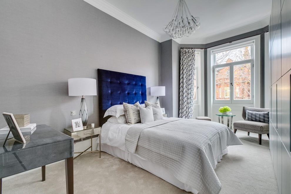 Transitional carpeted and gray floor bedroom photo in London with gray walls and no fireplace