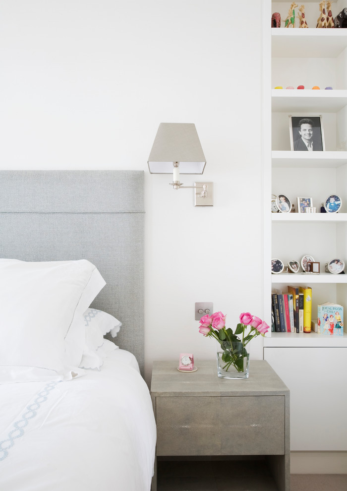Photo of a contemporary grey and pink bedroom in London.