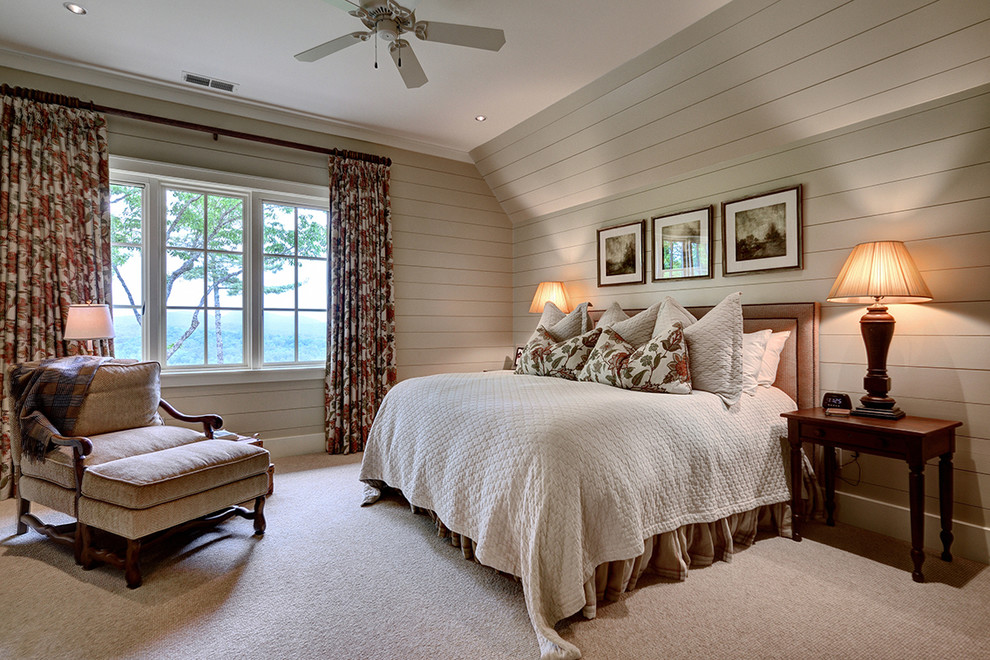 Farmhouse master loft bedroom in Other with grey walls and carpet.