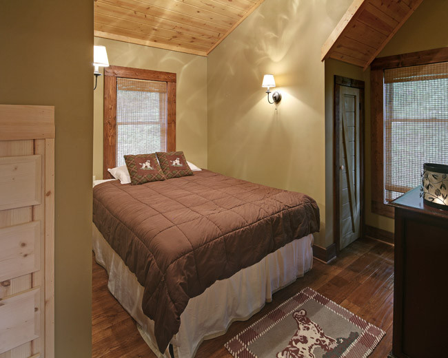 Design ideas for a medium sized classic guest bedroom in Atlanta with brown walls.