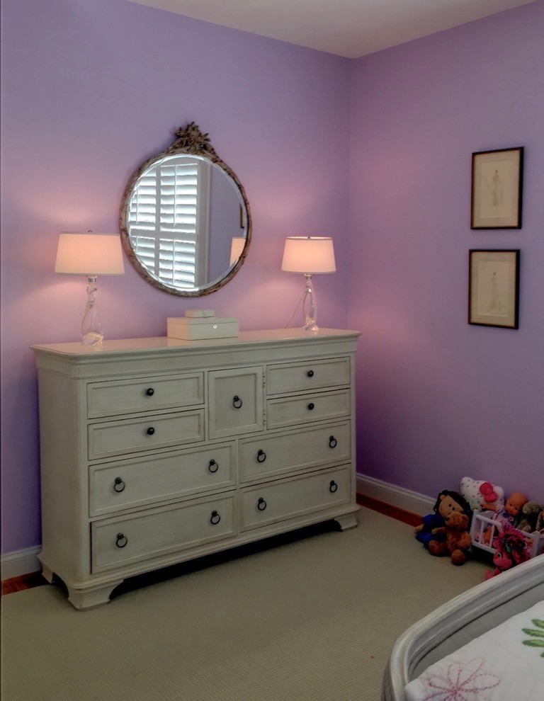 Design ideas for a medium sized traditional guest bedroom in DC Metro with purple walls and light hardwood flooring.