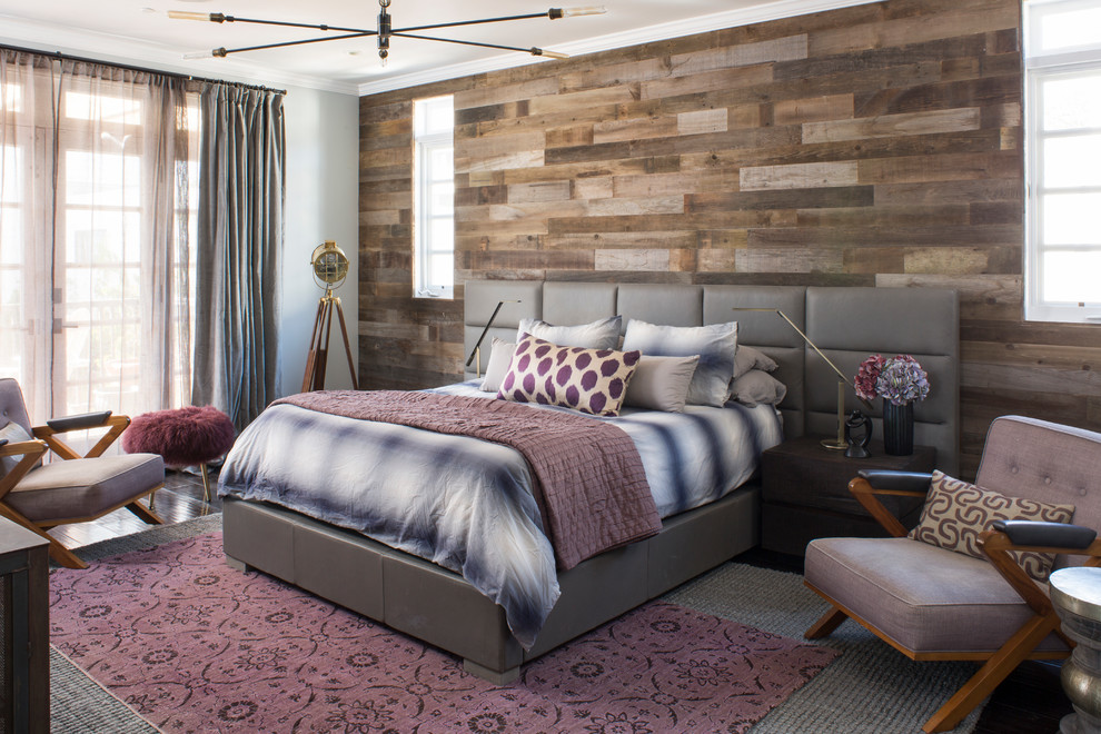 Example of a large trendy master dark wood floor bedroom design in Los Angeles with gray walls and no fireplace