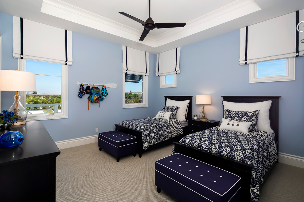 Example of a mid-sized beach style guest carpeted bedroom design in Miami with blue walls and no fireplace