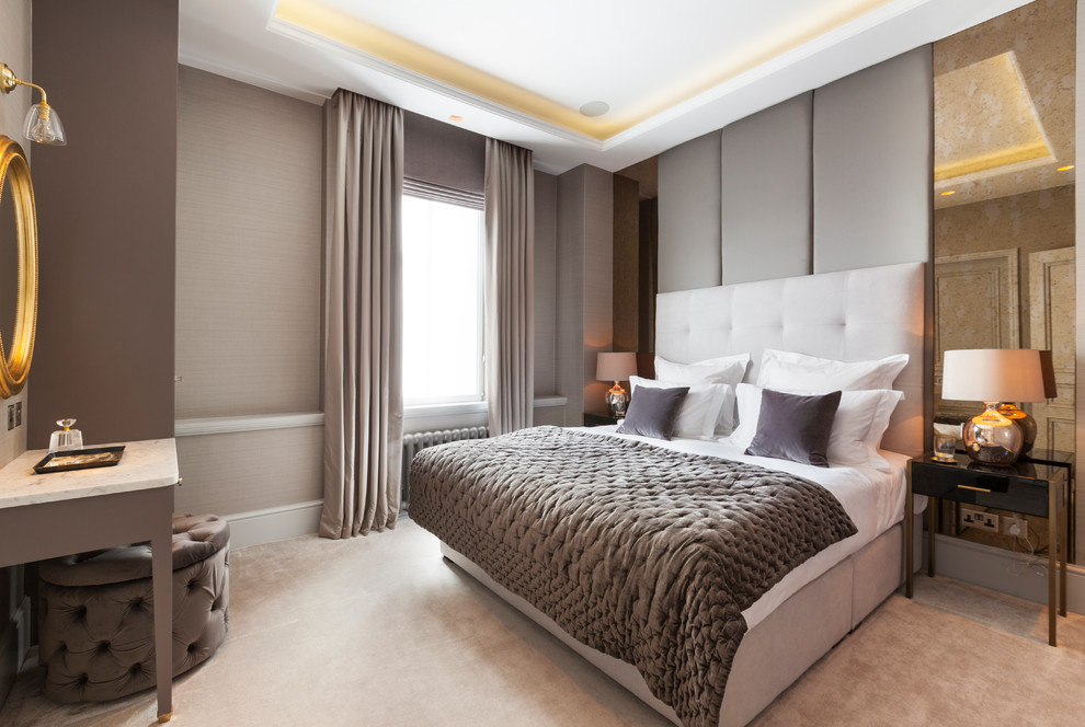 Design ideas for a medium sized traditional master bedroom in London with carpet, beige floors, beige walls and no fireplace.