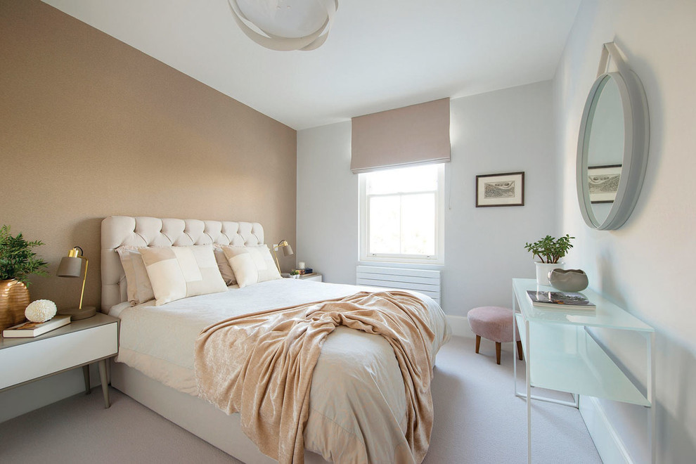 Contemporary master bedroom in London with white walls, carpet and grey floors.