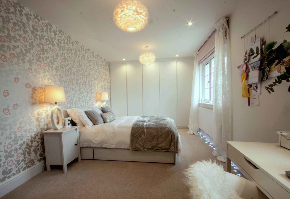 Photo of a contemporary bedroom in Surrey with white walls and carpet.