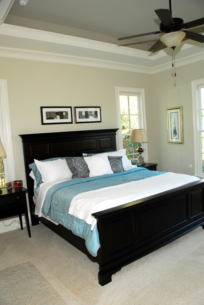 Example of a mid-sized classic master dark wood floor bedroom design in Charlotte with beige walls and no fireplace