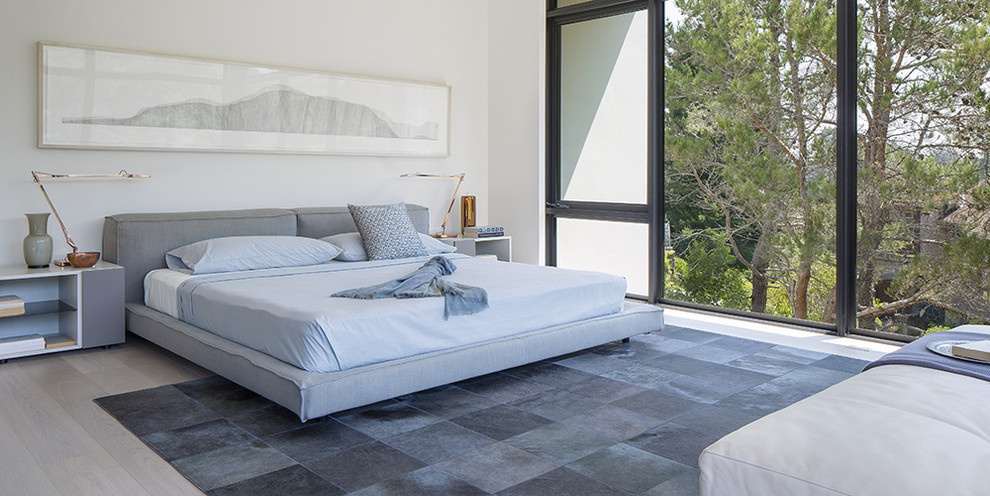 This is an example of a medium sized contemporary master bedroom in San Francisco with white walls.