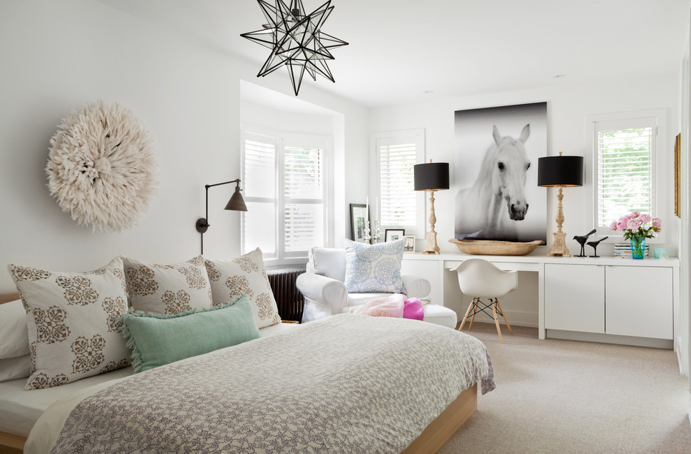 Photo of a contemporary master bedroom in Toronto with white walls and carpet.