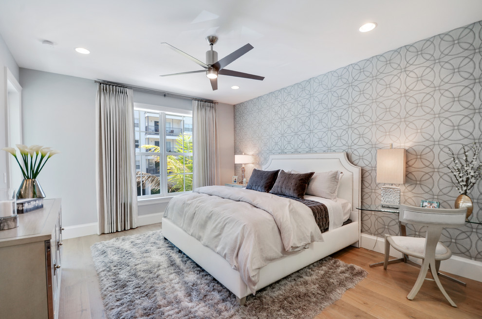 Design ideas for a large traditional master and grey and brown bedroom in Miami with grey walls, medium hardwood flooring, brown floors, no fireplace and a feature wall.