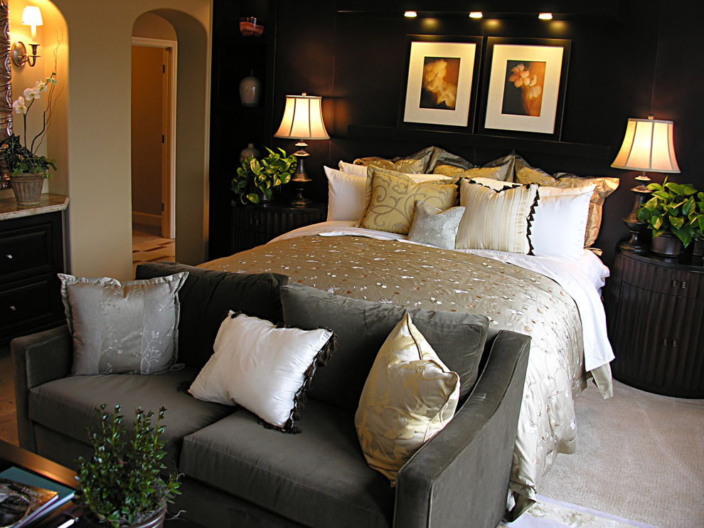 Inspiration for a tropical master bedroom remodel in Phoenix with black walls