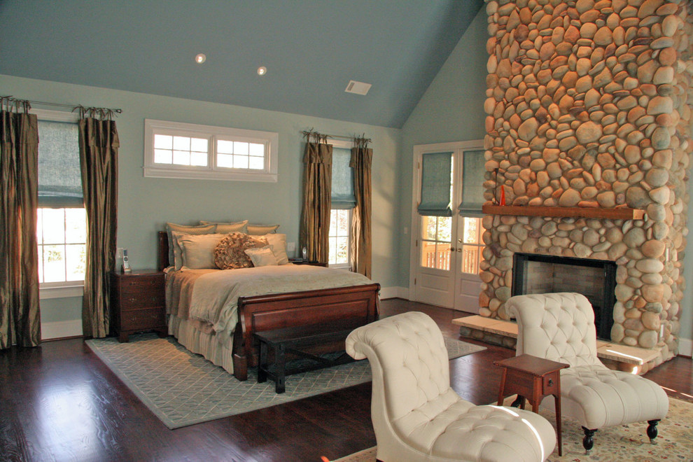 Bedroom - traditional dark wood floor bedroom idea in Atlanta with blue walls, a standard fireplace and a stone fireplace