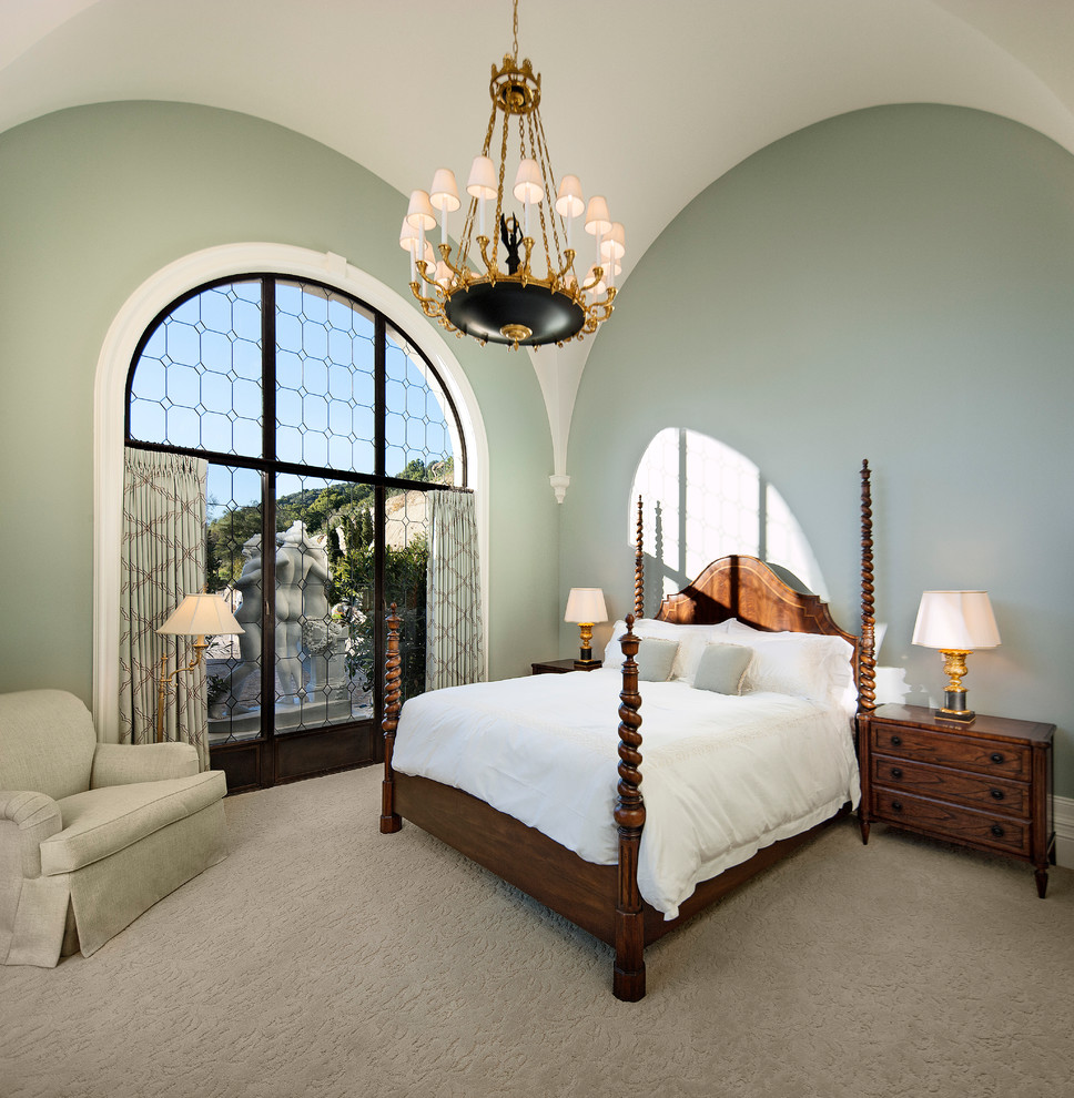 This is an example of a mediterranean bedroom in Santa Barbara with green walls.