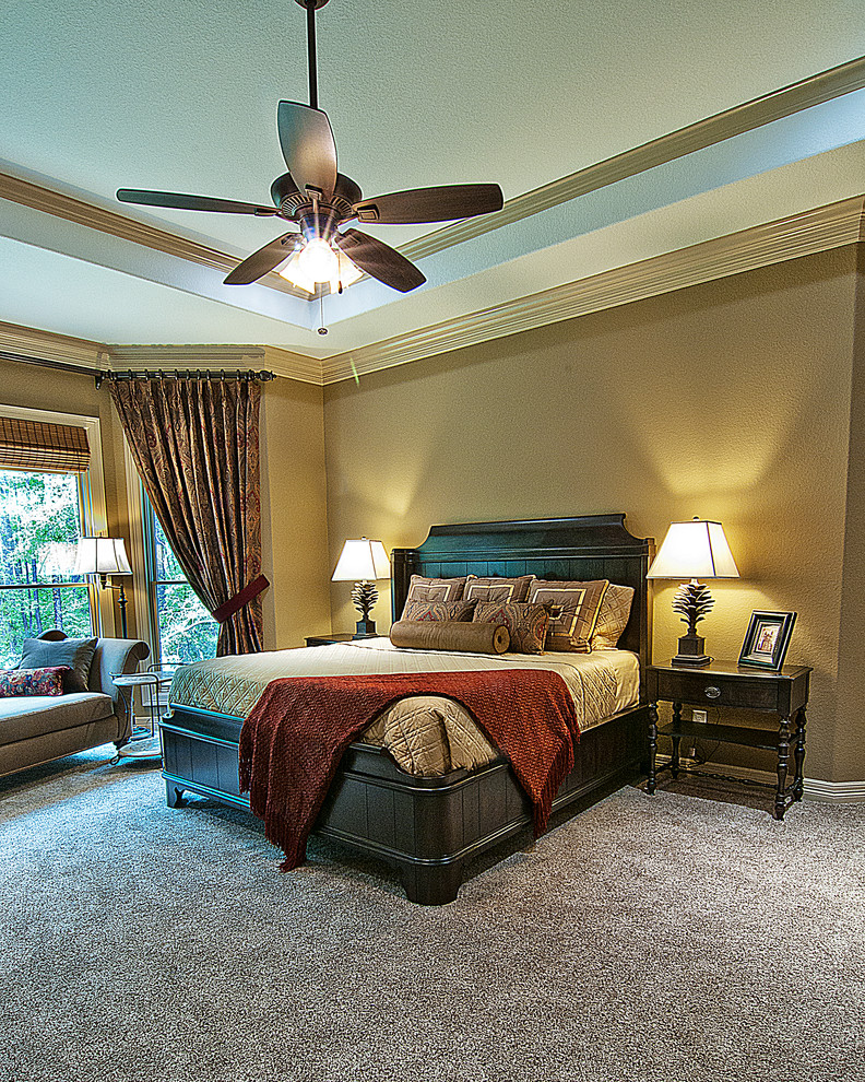 Example of a large classic master carpeted bedroom design in Other with beige walls and no fireplace