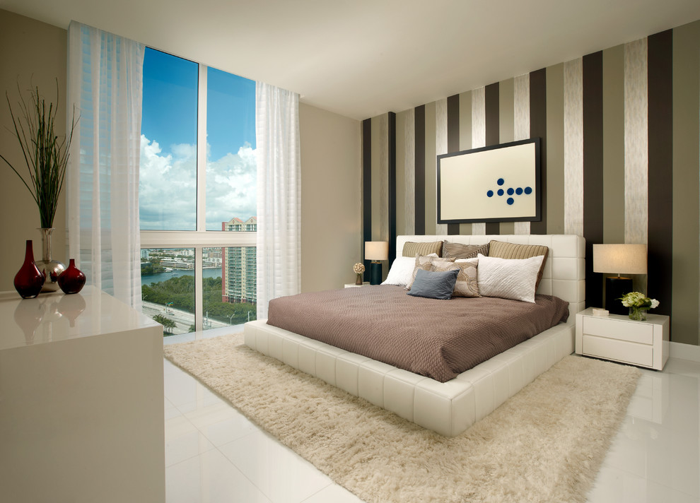 Photo of a contemporary bedroom in Miami with beige walls.