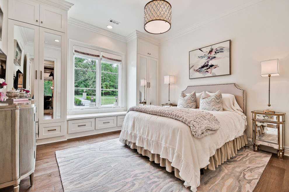 Photo of a large classic guest bedroom in Other with white walls, light hardwood flooring and a coffered ceiling.