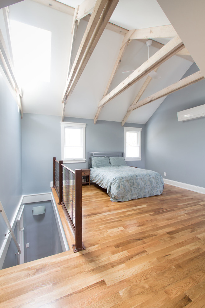 Medium sized contemporary master bedroom in Louisville with grey walls, medium hardwood flooring and multi-coloured floors.