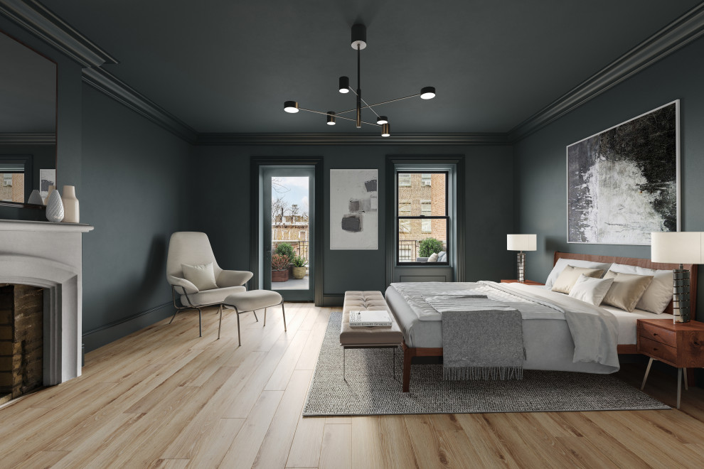 Design ideas for a large traditional master bedroom in New York with green walls, light hardwood flooring, a standard fireplace, a concrete fireplace surround and beige floors.