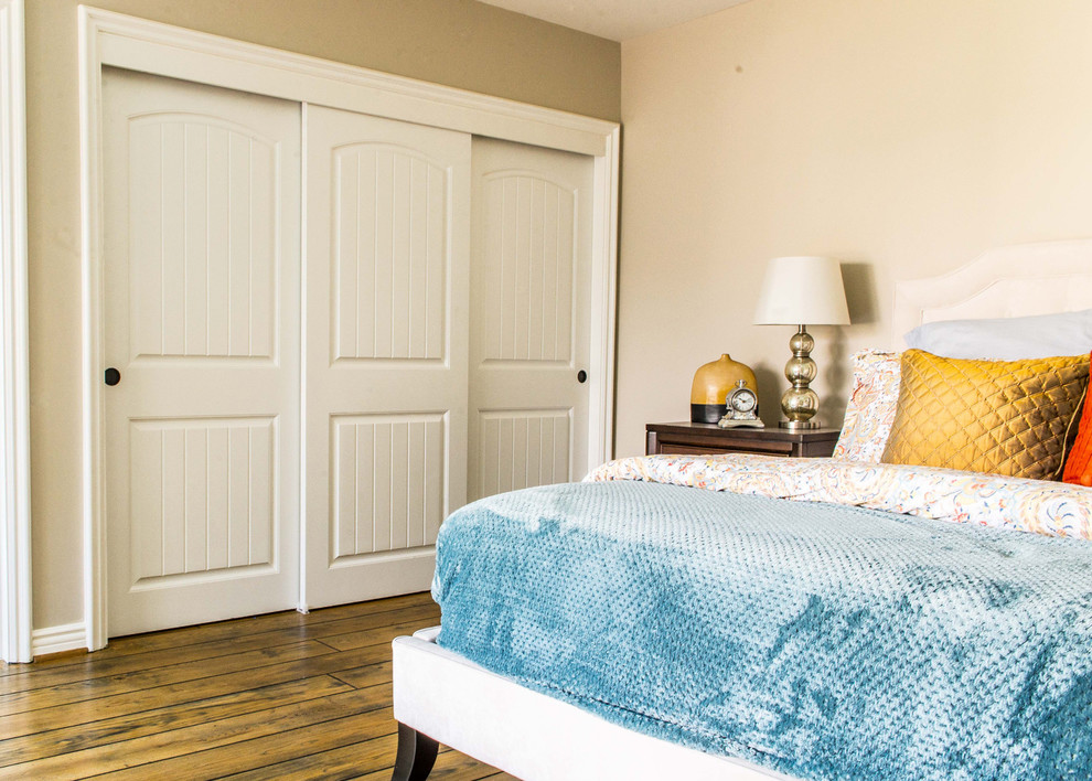 Example of a mid-sized trendy master dark wood floor bedroom design in Boston with beige walls