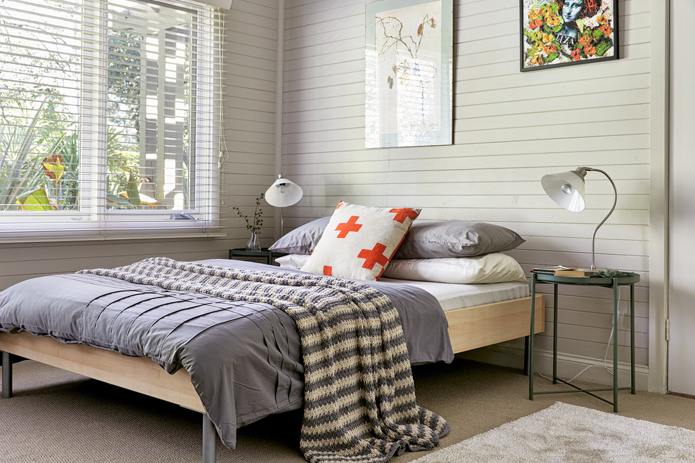 Photo of a contemporary bedroom in Melbourne with beige walls, carpet and beige floors.
