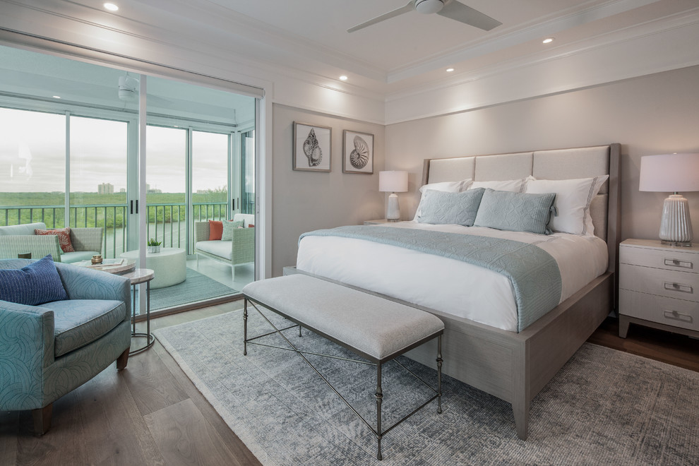 Bedroom - mid-sized coastal master light wood floor and brown floor bedroom idea in Miami with white walls and no fireplace