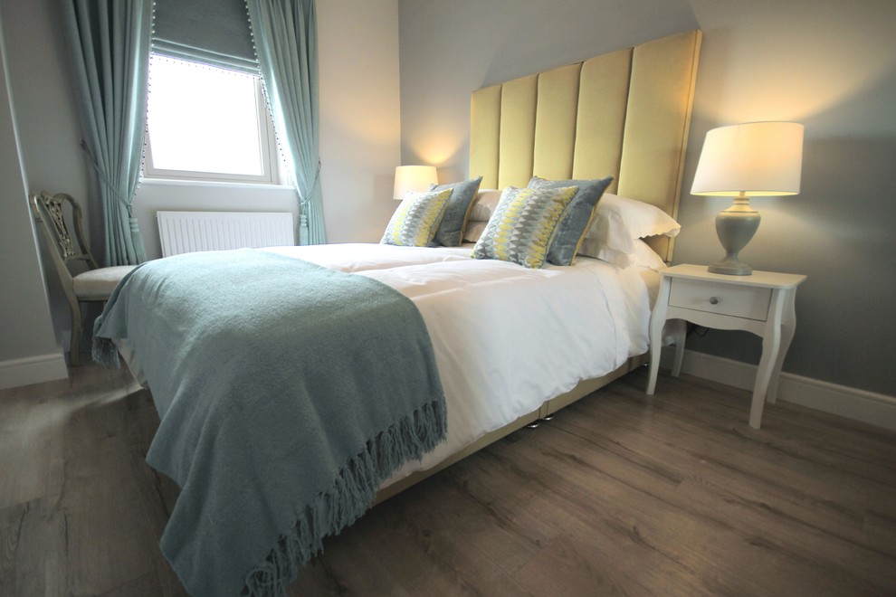 Design ideas for a small nautical guest bedroom in Dublin with grey walls, laminate floors and grey floors.