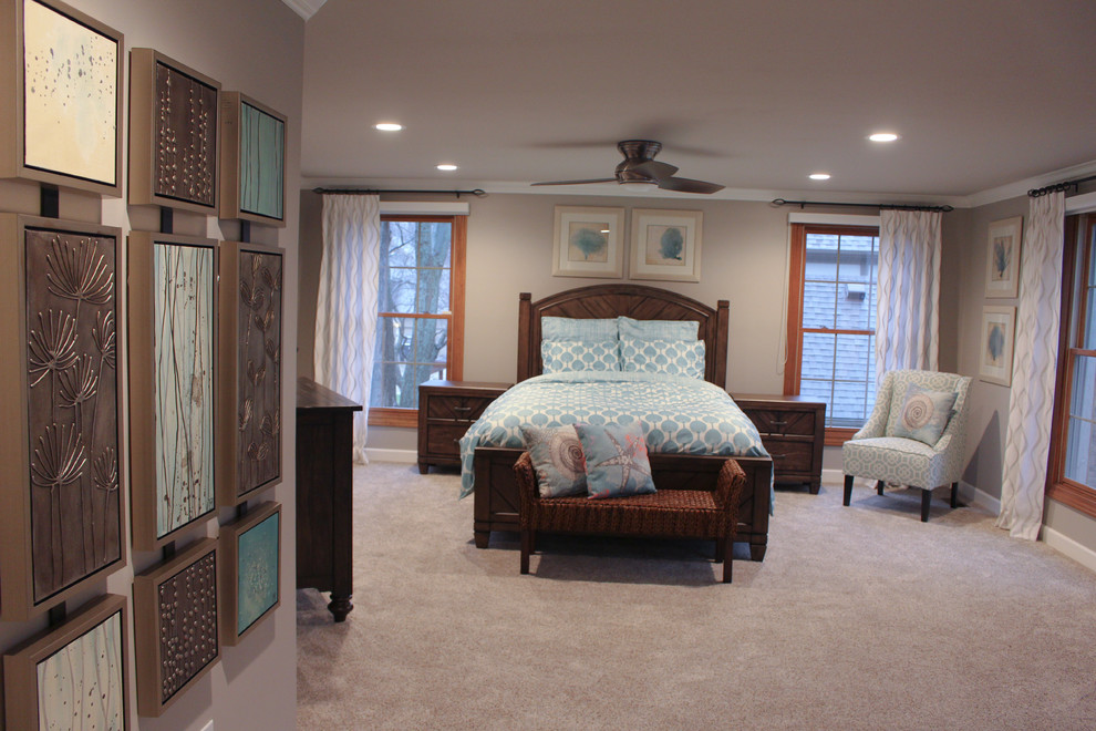 Beach style master bedroom in Detroit with beige walls, carpet and no fireplace.