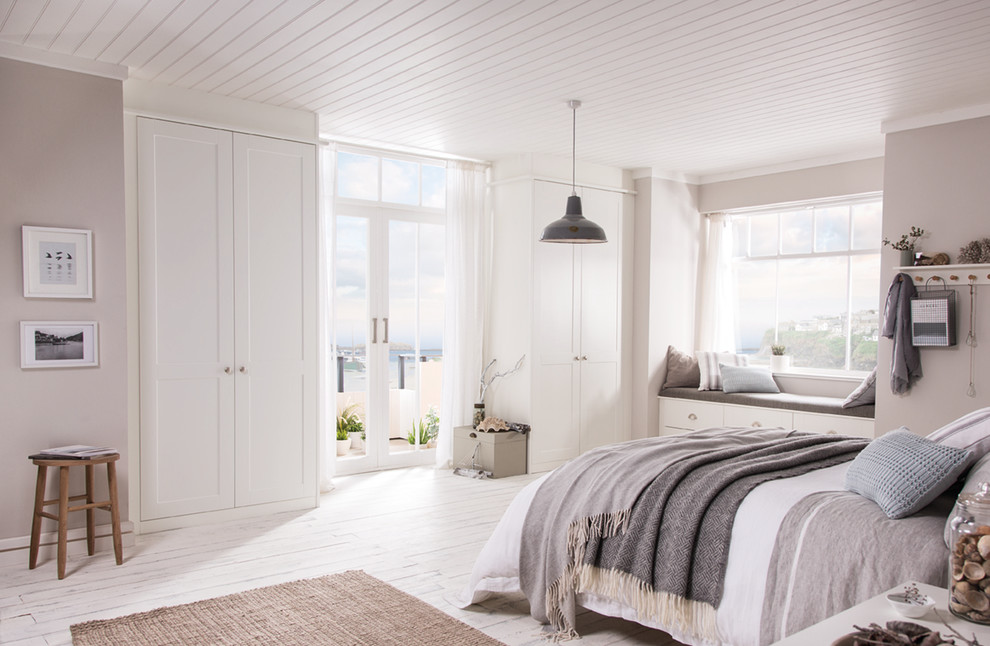 This is an example of a nautical grey and cream bedroom in West Midlands.