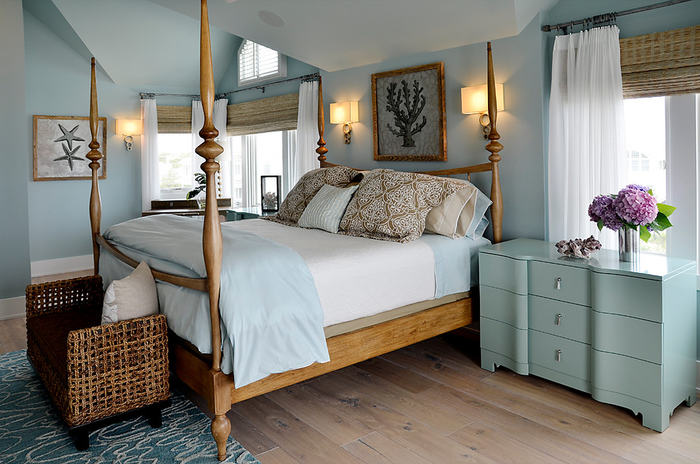 Bedroom - large coastal master light wood floor bedroom idea in Philadelphia with blue walls