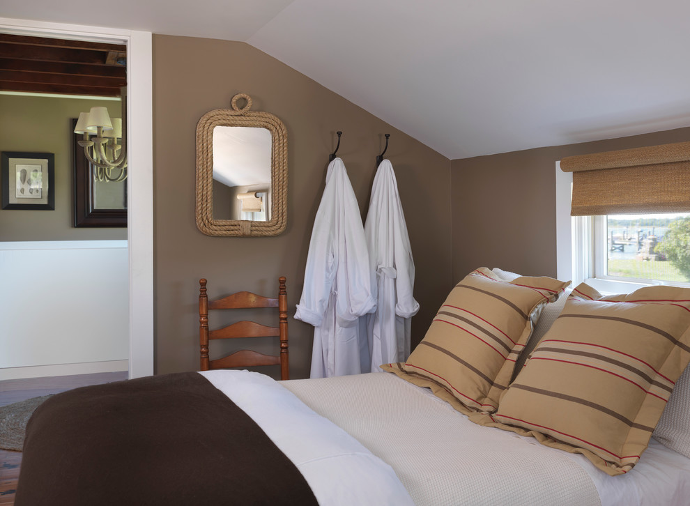 Beach style bedroom photo in Providence with brown walls