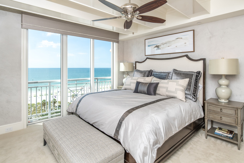 Beach style guest carpeted and beige floor bedroom photo in Tampa with gray walls and no fireplace