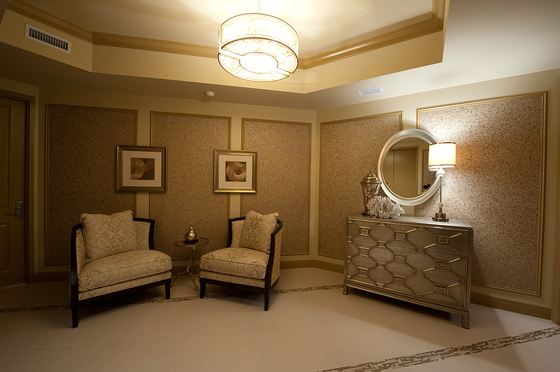 Design ideas for a large traditional master bedroom in Miami with beige walls and ceramic flooring.