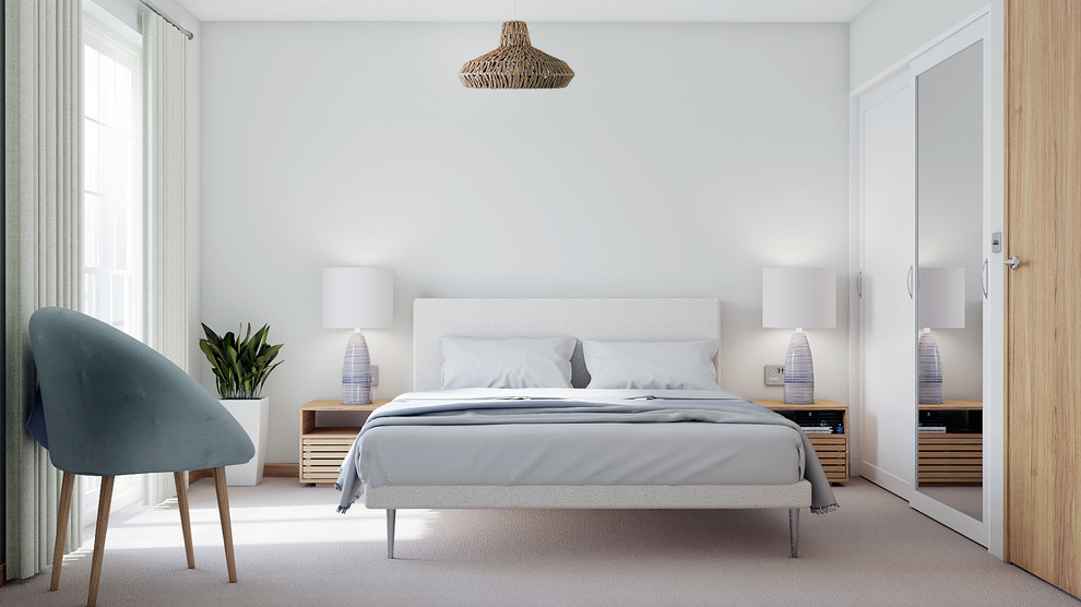 ケンブリッジシャーにある中くらいなビーチスタイルのおしゃれな客用寝室 (白い壁、カーペット敷き)