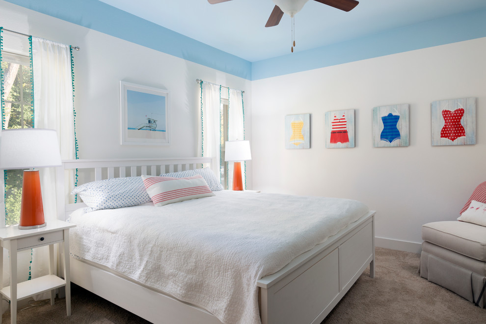 Photo of a medium sized beach style guest bedroom in Milwaukee with white walls, carpet and beige floors.