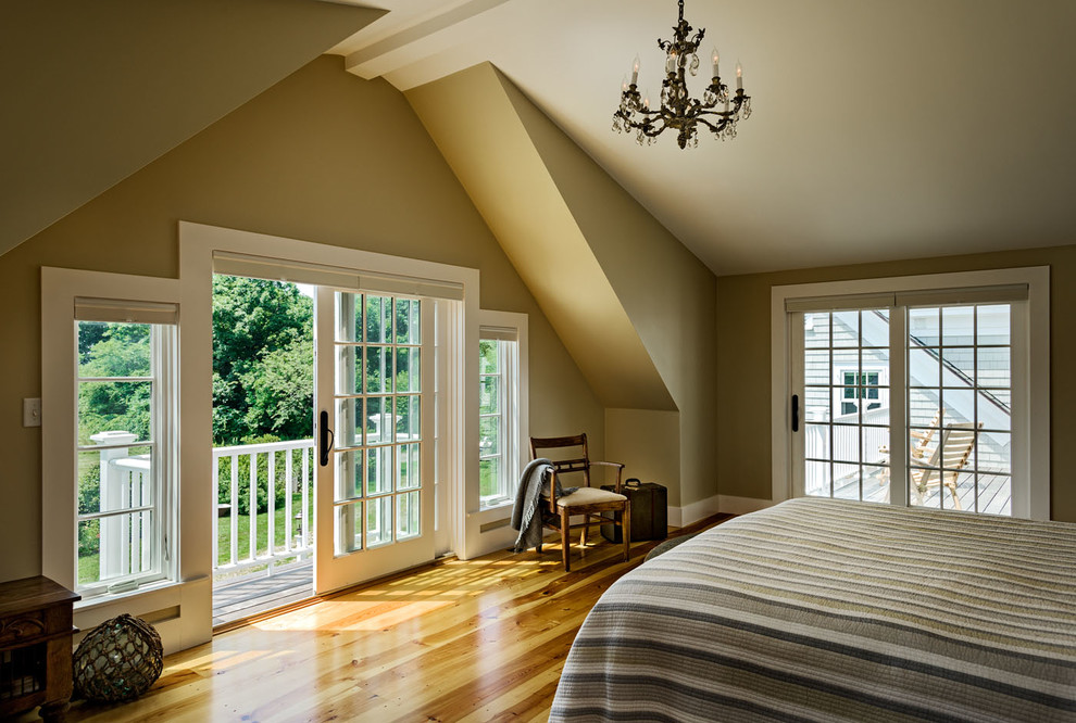 Bedroom - mid-sized coastal master light wood floor bedroom idea in Boston with beige walls