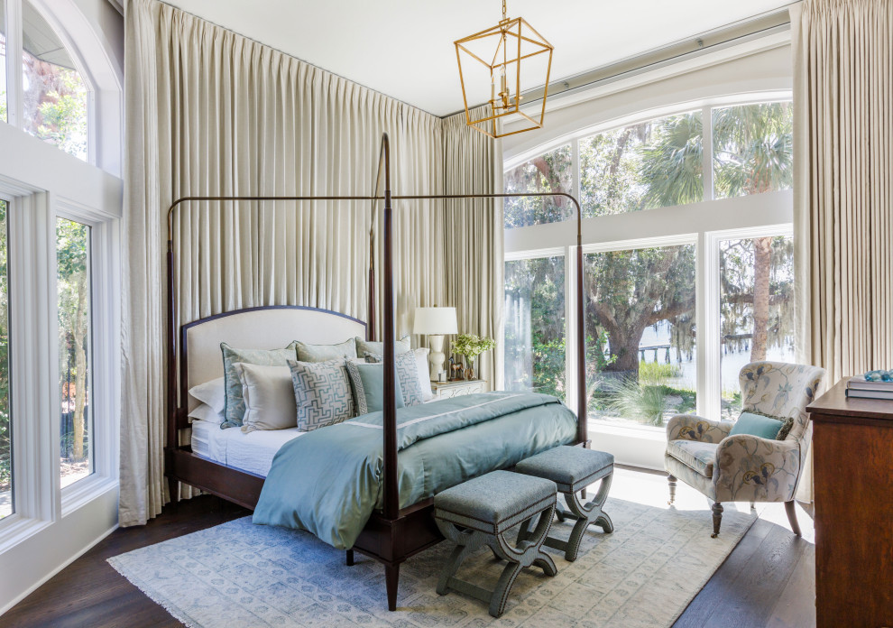 Inspiration for a large mediterranean guest dark wood floor and brown floor bedroom remodel in Jacksonville with white walls